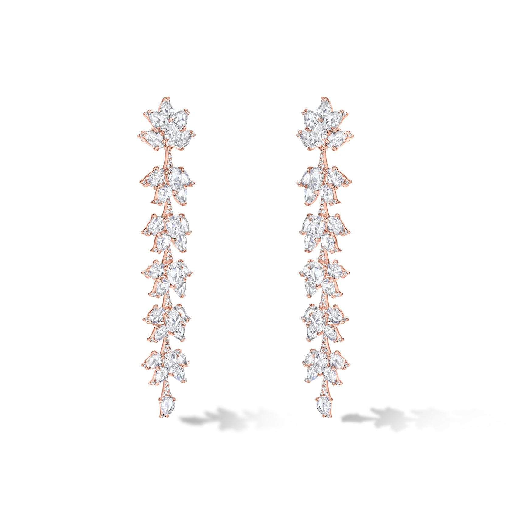 Image of 64facets diamond dangle earrings made with diamonds in the shape of lotus flowers and set in 18k gold